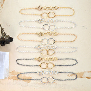 collection of delicate chain bracelets and dainty charm bracelets, simple hammered charms are easy to wear or layer like a boho beach goddess. bangle bracelets and cuffs - charming alone or in a stack