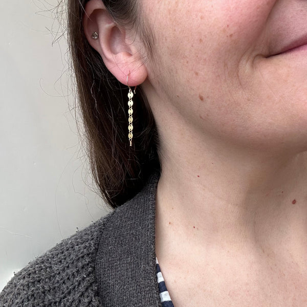 pieces of eight earrings gold dangle earring handmade circle chain ear rings simple jewelry sustainable earrings on model