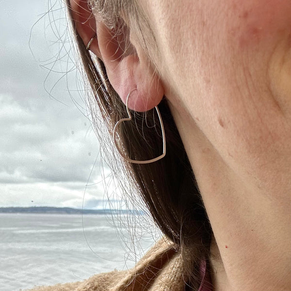 shining heart hoops open heart hoop earrings hoops handmade earrings matte silver heart shaped hoops on model