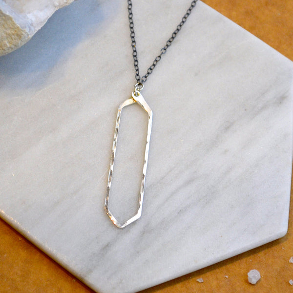 Boardwalk Necklace - hammered long hexagon silhouette pendant necklace - Foamy Wader