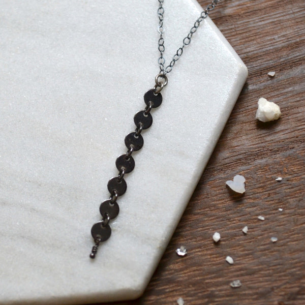 pieces_of_eight_necklace_y_necklaces_coin_dangle_chain_necklace_custom_chains_oxidized_silver_sustainable_jewelry